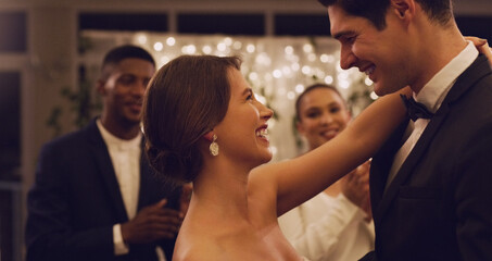 Im already loving being married to you. Cropped shot of an affectionate young newlywed couple dancing in front of their guests at their wedding reception. - Powered by Adobe