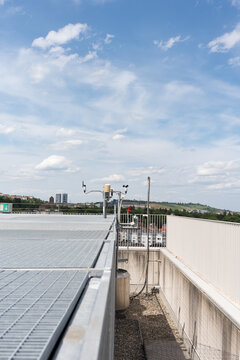 Weather equipment and alarm system on the building. Meteorological equipment is installed on the roof of the building. Alarm sensors and additional equipment.