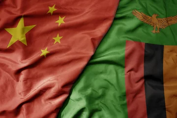 Foto op Aluminium big waving national colorful flag of china and national flag of zambia . © luzitanija