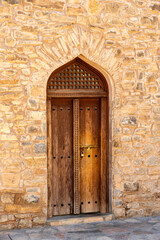 Fototapeta na wymiar old wooden door in Sur, Oman