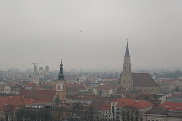 Fototapeta na wymiar Cluj-Napoca Under a Misty Cloudy Sky