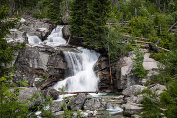 Naklejka premium Long waterfall on Cold water creek close to Hrebienok in High Tatras National Park, Slovakia