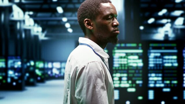 System administrator monitoring supercomputer cybersecurity threats arising due to unsecured network connections. Supervisor making sure server hub is invulnerable to DDoS attacks