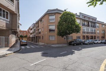 Facades of urban residential buildings at a crossroads