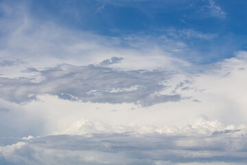 Obraz premium white fluffy clouds standing out against a blue sky