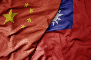 big waving national colorful flag of china and national flag of taiwan .