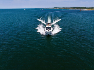 Aerial view of motor boat in Lake Michigan, Muskegon, MI, USA. Summer 2023