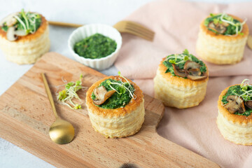 Puff pastry appetizer with spinach, mushrooms