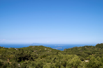 Great view to the surrounding scenery high from the mountain in Corfu, Greece