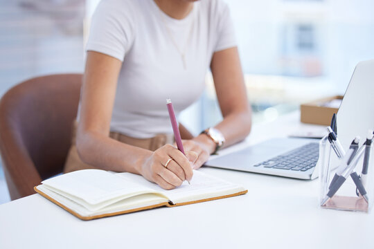 Business woman, hand and writing notes at a office desk with creative writer information. Content agency, paperwork and schedule planning of a female worker with a book, pen and article info at work