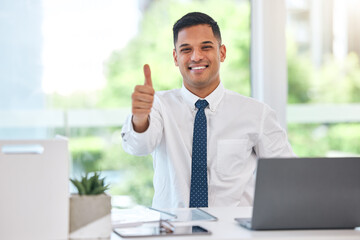 Happy businessman, portrait and thumbs up for success, good job or agreement by office desk. Man, accountant or employee smile with OK emoji, yes sign or like for business approval at the workplace
