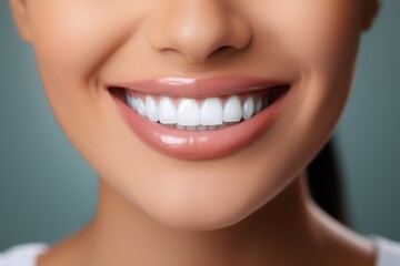 Perfect white healthy teeth of a smiling woman close-up. Portrait with selective focus and copy...
