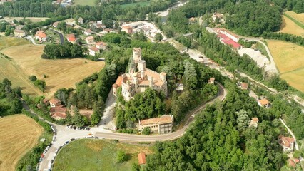 Aerial drone panoramic view of the Rocchetta Mattei castle in Italy on sunny summer day, view from above. High quality 4k footage