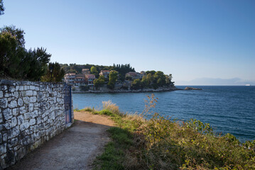 Fototapeta na wymiar Amazing scenery by the sea in Kassiopi village, Corfu, Greece