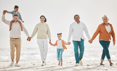 Happy family, fun portrait and beach with grandparents, parent love and kids together by sea. Outdoor, vacation and children with grandmother and father by the ocean on holiday in group with a smile