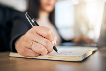 Business woman, hands and writing in book for planning, reminder or idea strategy on office desk. Closeup of female person, accountant or employee for schedule plan in notebook, diary or journal