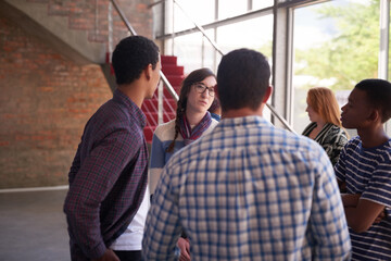 Obraz premium Catching up between their breaks. Cropped shot of a group of university students hanging out between class.