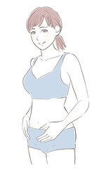 お腹に手を当てて微笑むスリムな女性