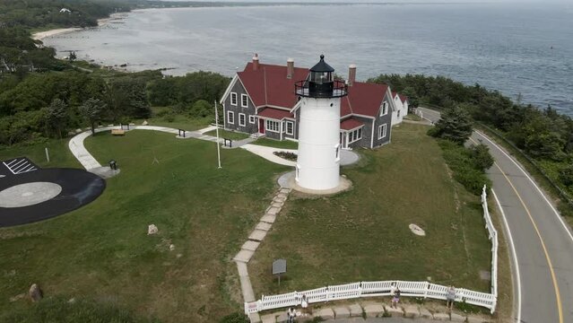 Nobska Lighthouse Is Iconic Cape Cod Landmark Offering Scenic Coastal View In Massachusetts, United States. aerial pull-back