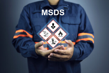 Safety staff show warning signs of hazardous substances material data in hand, indicating prepare...