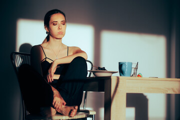 Unhappy Woman Being Bored Alone at Home Having no Appetite. Girl in a bad mood waking up early...