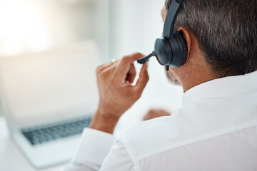 Back, call center and man listening for customer service, support and business with laptop. Contact...