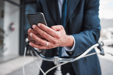Phone, typing and hands of businessman with bicycle for travel, transport or directions to office, building or work in the city. Man, search and connection to internet with bike for journey in town