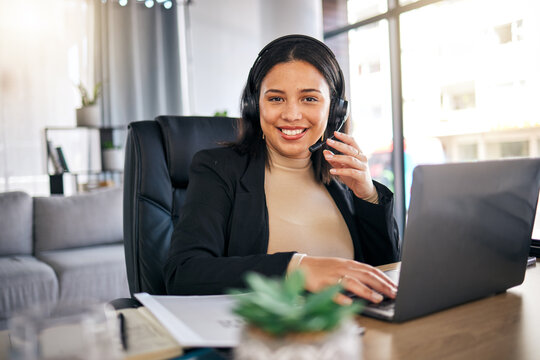 Happy woman, call center and laptop with headphones in remote work for customer service or support at home office. Friendly female person, consultant or freelance agent smile in online advice or help
