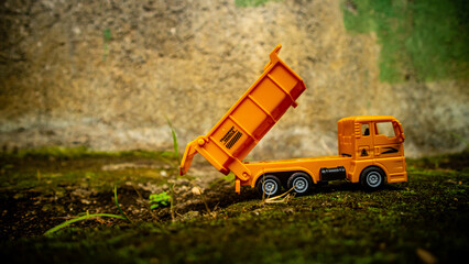 South Minahasa, Indonesia : January 2023, yellow dump truck toy