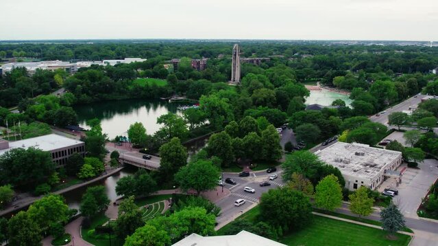 Phenomenal aerial Naperville Illinois - Centennial Beach in the summer and Millennium Carillon, Rotary Park Sled Hill, Moser Tower, Naperville Riverwalk in DuPage County