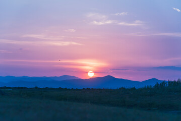 Violet purple sky in morning scenery Vibrant colorful blue sky summer time on sunrise. Natural beautiful landscape. Beauty purple sky romantic dramatic landscape cloudy outdoor paradise in sunset