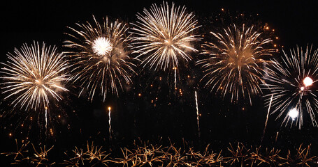 Golden Firework celebrate anniversary happy new year 2024, 4th of july holiday festival. Gold firework in the night time celebrate national holiday. Countdown to new year 2023 gold party time event