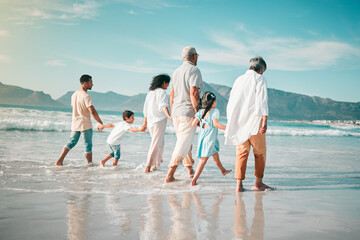 Holding hands, family is walking on beach with ocean and back view, solidarity and bonding in nature. Generations, people outdoor on tropical holiday and freedom, travel with trust and love in Mexico