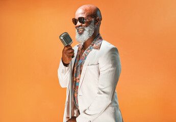 Lets jazz things up a little. Studio shot of a senior man wearing vintage clothes while singing...