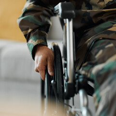 Man, hands and wheelchair in army from accident, war injury or healthcare support at hospital....