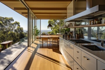 Inside the house, there is a contemporary kitchen that offers a stunning outlook.