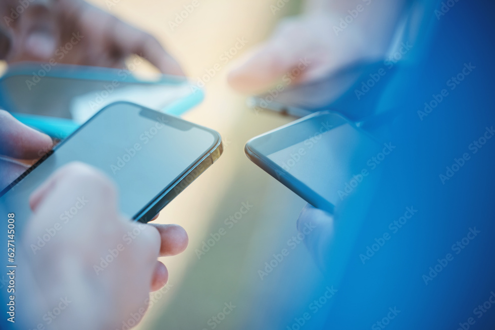 Poster Hands, phone and networking with people in a huddle or circle for communication or connectivity. Mobile, social media or information sharing and a person group standing together closeup with flare