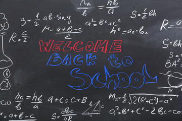 Fototapeta na wymiar Frame made of different formulas with text WELCOME BACK TO SCHOOL on black chalkboard