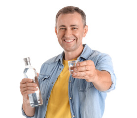 Mature man with bottle and glass of vodka on white background