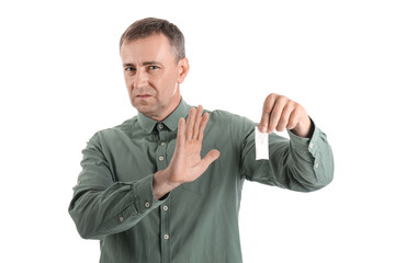 Mature junkie rejecting drugs on white background