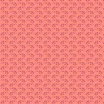 Cute delicate leavy pattern of purple burgundy leaves flat lay on muted pink coral background