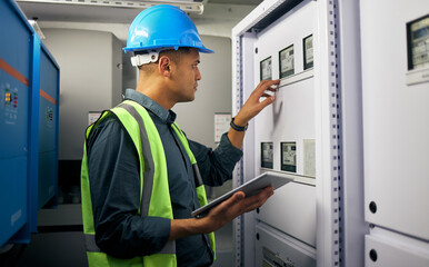 Technician, tablet and man, control room and inspection, maintenance check with power supply and...