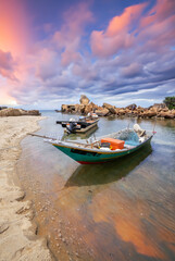 Fishing boat on the beach at Terengganu, Malaysia in the morning sunrise.. - 627152894