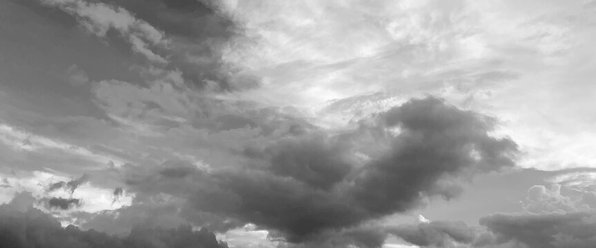 Panorama view of overcast sky, dramatic gray sky and white clouds before rain in rainy season, cloudy gray sky with thick dense clouds,  sky with storm clouds dark, The dark sky with heavy clouds.
