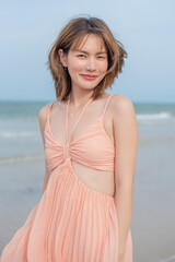 Fototapeta na wymiar young slim beautiful woman on sunset beach, playful, summer vacation, sunny, having fun, positive mood, romantic, traveller, happy, Happy mixed race girl in casual outfit with wind in her hair.