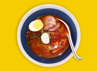 Kimchi Soup Ramen with Chashu Pork, boiled eggs, Thai style, topview, isolated, yellow background