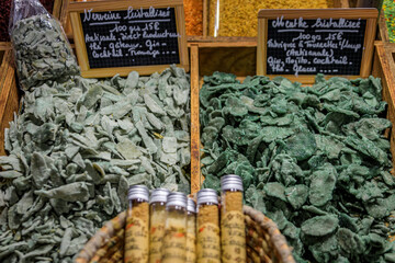 Sugar coated crystallized mint and verbena leaves, cocktail, ice cream and cheese garnish at a provencal farmers market in Antibes, South of France