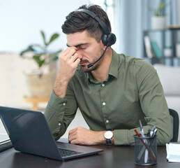 Man, laptop and headache in call center, stress or debt in customer service or support at the...