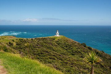 Fototapeta na wymiar The spot where the Tasman sea and Pacific oceans meet at Cape Reinga and its historic lighthouse 