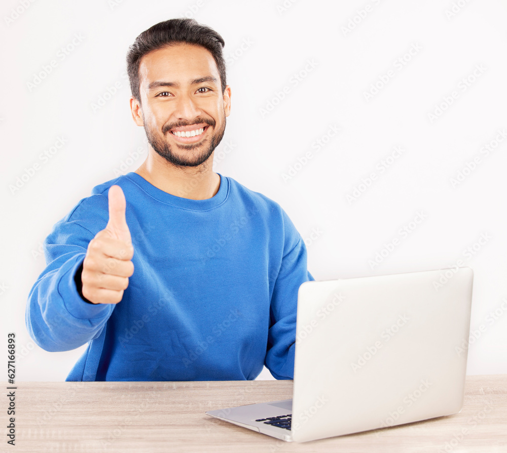 Poster portrait, laptop and thumbs up with an it support man at his desk in studio on a white background. s
